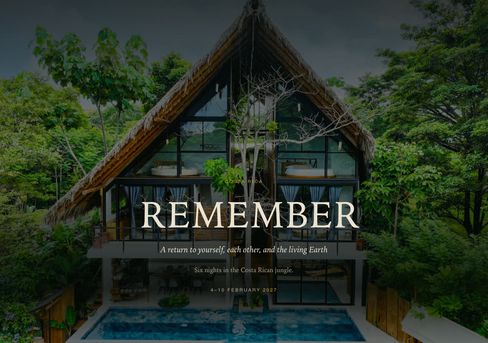Remember: a drone photograph of a jungle lodge at night with the word REMEMBER over it